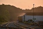 Morning dew begins to evaporate off the roof of River Valley Paper.